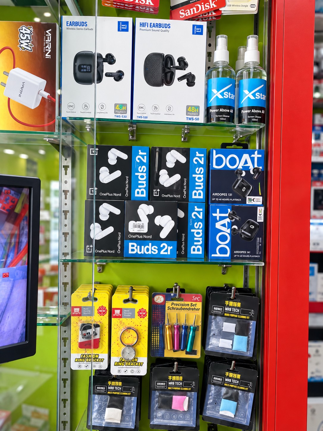 Real branded audio and fast charger display cabinet at Cell Star Erode